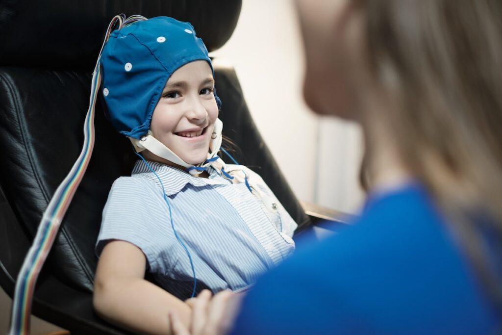 young girl with autism getting an eeg